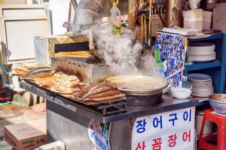 Busan, South Korea - October 7, 2017: Amazing view of pot of traditional Korean soup steaming at street cafe in Jagalchi Fish Market. Freshly cooked fish.のeditorial素材