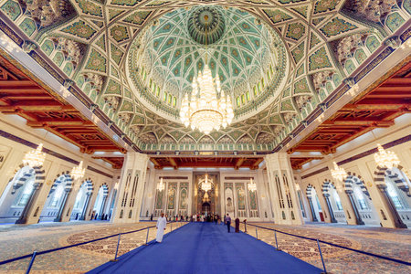 Muscat, Oman - 17 October, 2018: Main view of prayer hall in the Sultan Qaboos Grand Mosque. Beautiful interior of the Muslim place. Amazing Islamic architecture and decoration.のeditorial素材