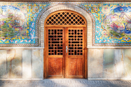 Tehran, Iran - 19 October, 2018: Scenic view of carved wooden door leading to inside the Golestan...