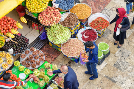 Tehran, Iran - 18 October, 2018: Unusual top view of fruit stall at Tajrish Bazaar. Colorful ripe freshly harvested fruits. The historical market is a popular tourist destination of the Middle East.のeditorial素材