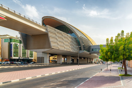 Dubai, United Arab Emirates - 2 November, 2018: Scenic view of ADCB Metro Station on blue sky background. Deserted Sheikh Khalifa Bin Zayed Street. Dubai is a popular tourist destination of UAE.のeditorial素材