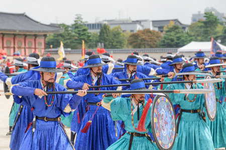 Seoul, South Korea - October 9, 2017: Amazing scene of performance with historical reconstruction at courtyard of Gyeongbokgung Palace. Royal guards wearing blue Jeonbok. Traditional military clothingのeditorial素材