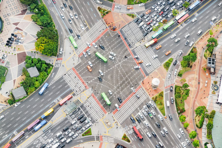 Aerial view of road intersection at downtown of Seoul in South Korea. Cars and colorful buses on streets. Day traffic. Seoul is a popular tourist destination of Asia.のeditorial素材