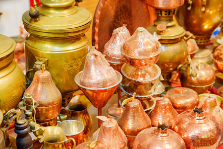 Kashan, Iran - 21 October, 2018: Wide range of traditional Iranian copper cookware in souvenir shop. Persian samovars and jugs. Kashan is a popular tourist destination of the Middle East.のeditorial素材