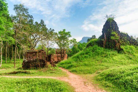 Scenic view of ruins of My Son Sanctuary among green woods in Da Nang (Danang), Vietnam. My Son is a complex of partially ruined ancient Hindu temples constructed by the kings of Champa.の写真素材