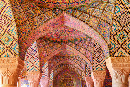 Shiraz, Iran - 29 October, 2018: Fabulous view of vault ceiling covered colorful mosaic inside the Nasir al-Mulk Mosque (Pink Mosque). Amazing Persian interior of the Muslim place.のeditorial素材