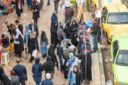 Tehran, Iran - 18 October, 2018: Top view of Iranian women buying clothes and pedestrians walking along Shahrdari Street. Tehran is a popular tourist destination of the Middle East.のeditorial素材