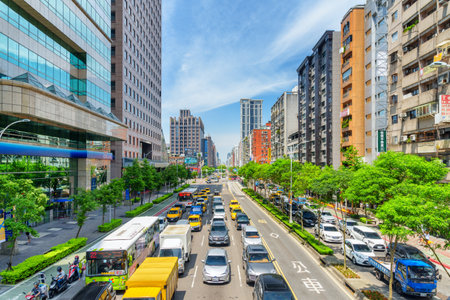 Taipei, Taiwan - April 25, 2019: Fabulous view of Xinyi Road on sunny day. Day traffic of Taipei. Scenic cityscape. Taiwan is a popular tourist destination of Asia.