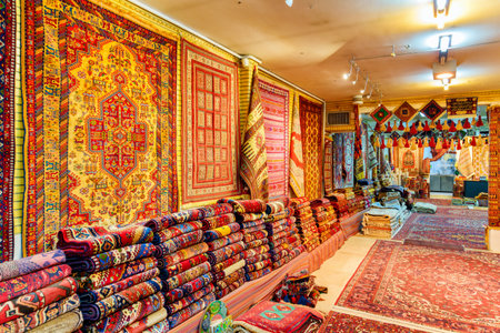 Isfahan, Iran - 24 October, 2018: Wonderful inside view of carpet shop in the Grand Bazaar (Qeysarie Bazaar). Wide range of famous colorful Persian rugs. Fabulous traditional patterns and ornaments.のeditorial素材