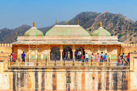 Jaipur, India - 12 November, 2018: Awesome colorful view of the Suhag Mandir above the Ganesh Pol Gate of the Amer Fort and Palace (Amber Fort) in Rajasthan. Amazing Rajput military hill architecture.のeditorial素材
