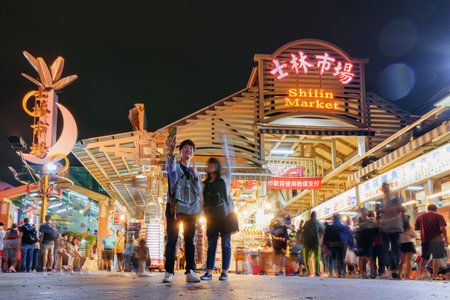 Taipei, Taiwan - April 26, 2019: Tourists taking pictures at Shilin Night Market. The night market is a popular tourist destination and famous shopping area of Asia.のeditorial素材