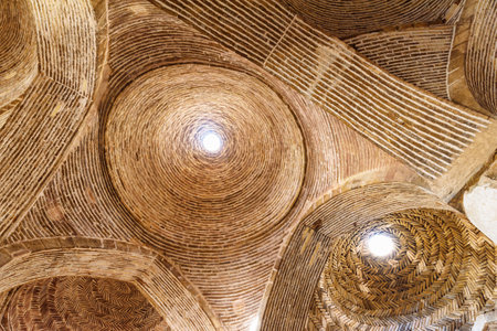 Isfahan, Iran - 23 October, 2018: Amazing ceiling of ancient hypostyle hall inside the Jameh Mosque...