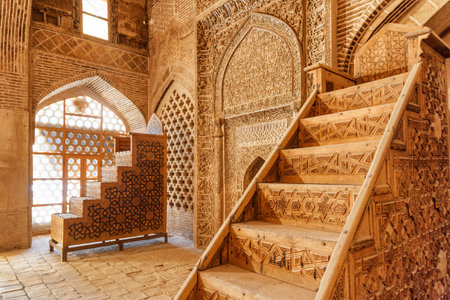 Isfahan, Iran - 23 October, 2018: Amazing sanctuary and two ancient wooden carved stands used for preaching inside the Jameh Mosque of Isfahan. Awesome interior of the Muslim place.のeditorial素材