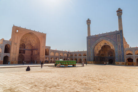 Isfahan, Iran - 23 October, 2018: Awesome view of courtyard of the Jameh Mosque of Isfahan. The Muslim place is a popular tourist attraction of the Middle East. Amazing Islamic architecture.のeditorial素材
