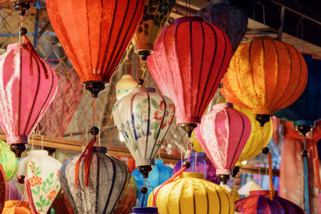 Hoi An (Hoian), Vietnam - April 11, 2018: Awesome view of traditional colorful silk lanterns in souvenir shop at Hoi An Ancient Town. Hoian is a popular tourist destination of Asia.のeditorial素材
