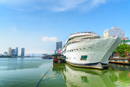 Da Nang (Danang), Vietnam - April 15, 2018: Awesome view of DHC Yacht parked on the Han River at downtown. Amazing cityscape. Danang is a popular tourist destination of Asia.のeditorial素材