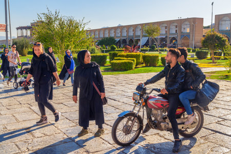 Isfahan, Iran - 23 October, 2018: Residents walking along Naqsh-e Jahan Square. The square is a popular tourist destination of the Middle East and recreational gathering place among residents.のeditorial素材