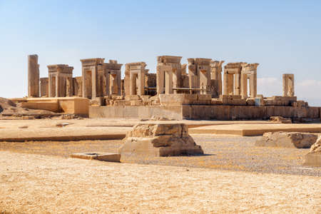 Scenic main view of ruins of the Tachara Palace on blue sky background in Persepolis, Iran. The most intact of all ruins at the ceremonial capital of the Achaemenid Empire. Ancient Persian city.の写真素材