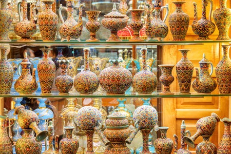 Isfahan, Iran - 24 October, 2018: Gorgeous view of traditional Iranian colorful souvenir tableware in the Grand Bazaar (Qeysarie Bazaar). Wide range of famous Persian ceramics at the historical marketのeditorial素材