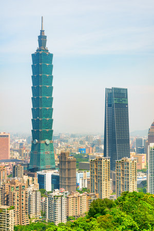 Taipei, Taiwan - April 25, 2019: Amazing view of Taipei 101 (Taipei World Financial Center) and other skyscrapers of downtown from top of mountain. The tower is a landmark of Taiwan. Scenic cityscape.のeditorial素材