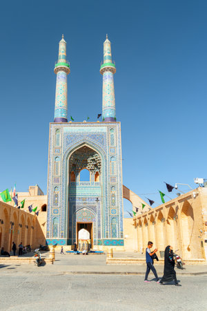 Yazd, Iran - 26 October, 2018: Gorgeous view of grand iwan of the Jameh Mosque of Yazd. The portal decorated with dazzling blue tile work. Azari style of Persian Islamic architecture.のeditorial素材