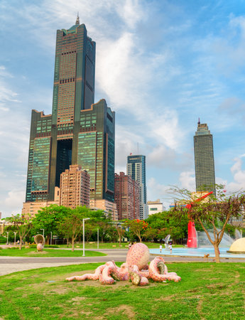 Kaohsiung, Taiwan - April 30, 2019: Amazing view of Singuang Riverside Park, 85 Sky Tower (Tuntex Sky Tower) and other modern buildings of downtown. Kaohsiung is a popular tourist destination of Asia.のeditorial素材