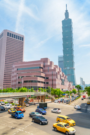 Taipei, Taiwan - April 25, 2019: Scenic view of intersection of Xinyi Road and Keelung Road on sunny day. Taipei 101 (Taipei World Financial Center) is visible at right. Day traffic. Amazing cityscapeのeditorial素材