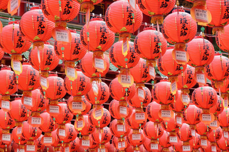 Kaohsiung, Taiwan - April 30, 2019: Fabulous view of scenic rows of traditional Chinese red lanterns at Sanfeng Temple. The old temple is a popular attraction among tourists and pilgrims of Asia.のeditorial素材