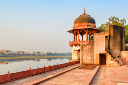 Fabulous view of the Yamuna River and scenic traditional pavilion at the Tomb of Itimad-ud-Daulah (Baby Taj) in Agra, India. Mughal architecture. Agra is a popular tourist destination of South Asia.のeditorial素材