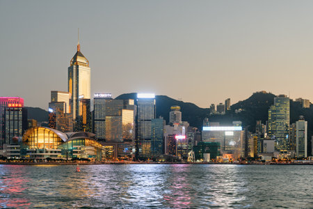 Hong Kong - October 19, 2017: Awesome view of Hong Kong Island skyline across Victoria harbor at sunset. Amazing cityscape. Hong Kong is a popular tourist destination of Asia.のeditorial素材