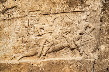 Bas-relief at ancient necropolis Naqsh-e Rustam in Iran. Detail of large tomb belonging to...