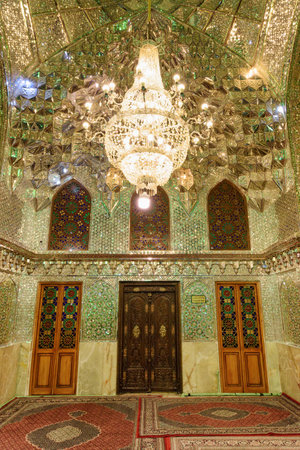 Shiraz, Iran - 29 October, 2018: Interior of prayer hall in Ali Ibn Hamzeh Holly Shrine. Ceiling and walls of the Muslim place covered with glass and mirror tiles. Shimmering mosaic.のeditorial素材