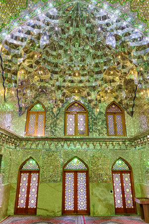 Shiraz, Iran - 29 October, 2018: Fabulous interior of prayer hall in Ali Ibn Hamzeh Holly Shrine. Ceiling and walls of the Muslim place covered with glass and mirror tiles. Shimmering mosaic.のeditorial素材