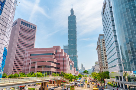 Taipei, Taiwan - April 25, 2019: Awesome view of Xinyi Road and Taipei 101 (Taipei World Financial Center) on sunny day. The tower is a supertall skyscraper and a landmark of Taiwan. Scenic cityscape.のeditorial素材
