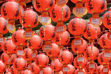 Kaohsiung, Taiwan - April 30, 2019: Scenic rows of traditional Chinese red lanterns at Sanfeng Temple. The old temple is a popular attraction among tourists and pilgrims of Asia.のeditorial素材