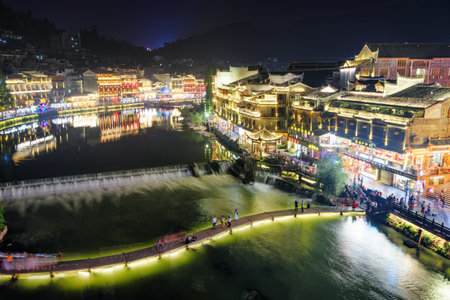 Fenghuang, China - September 23, 2017: Fabulous aerial night view of Phoenix Ancient Town and the Tuojiang River (Tuo Jiang River). Fenghuang is a popular tourist destination of Asia.のeditorial素材