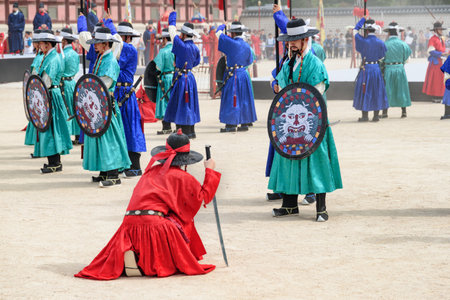 Seoul, South Korea - October 9, 2017: Performance with historical reconstruction at courtyard of Gyeongbokgung Palace. Royal guards wearing the Jeonbok, Korean traditional military clothing.のeditorial素材
