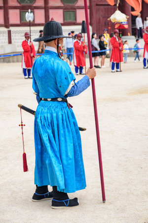 Seoul, South Korea - October 9, 2017: Performance with historical reconstruction at courtyard of Gyeongbokgung Palace. Royal guards wearing the Jeonbok, Korean traditional military clothing.のeditorial素材