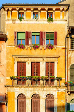 Colorful facade of old house in Verona, Italy. Verona is a popular tourist destination of Europe.の写真素材