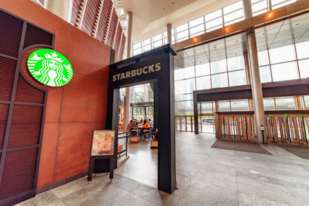 Shanghai, China - October 31, 2015: Starbucks Coffee at the Pudong New District (Lujiazui) in downtown. Shanghai is a popular tourist destination of Asia and a global financial center.のeditorial素材