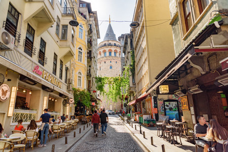 Istanbul, Turkey - September 15, 2021: View of the Galata Tower from an old narrow street. Istanbul is a popular tourist destination in the world.のeditorial素材
