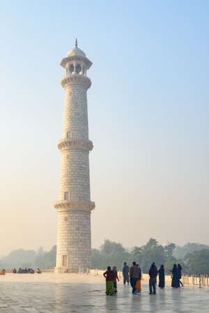 Agra, India - Visitors walking along the Taj Mahal complex. The Taj Mahal is a popular tourist attraction of South Asia.の写真素材