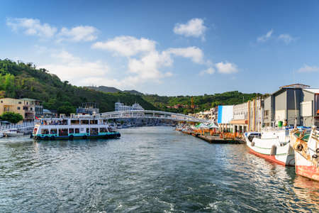 Ferry crossing Kaohsiung Harbor, Taiwan. Amazing view of scenic white bridge over Gushan Marina....