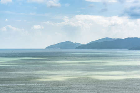 Awesome aerial view of Nha Trang Bay of the South China Sea in Vietnam. The Hon Tre Island is visible at sunset. Amazing seascape.の写真素材