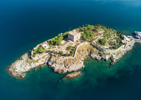 Aerial view of Guvercinada Island (Pigeon Island) with scenic castle at Kusadasi, Turkey. The large...