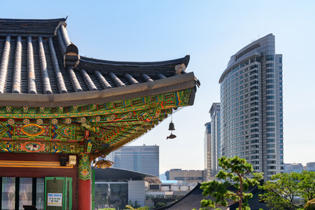 Seoul, South Korea - October 15, 2017: Colorful traditional Korean tile roof of Bongeunsa Temple and modern buildings at Gangnam District. Bongeunsa Temple is a popular tourist attraction of Asia.のeditorial素材