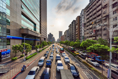 Taipei, Taiwan - April 26, 2019: Scenic aerial view of Xinyi Road at sunset. Day traffic of Taipei. Awesome cityscape. Taiwan is a popular tourist destination of Asia.のeditorial素材