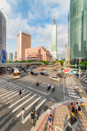 Taipei, Taiwan - April 26, 2019: Unusual view of intersection of Xinyi Road and Keelung Road at downtown. Taipei 101 (Taipei World Financial Center) is visible at right. Day traffic.のeditorial素材