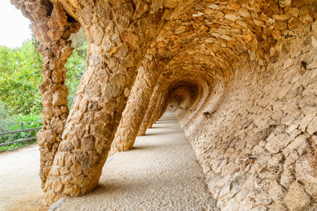 Amazing passage at the Park Guell in Barcelona, Spain. The park is designed by Antoni Gaudi. Barcelona is a popular tourist destination of Europe.のeditorial素材
