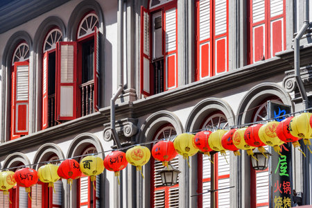 Singapore - February 17, 2017: Awesome view of scenic red windows. Amazing old traditional Chinese house decorated with lanterns. Beautiful Asian interior.のeditorial素材